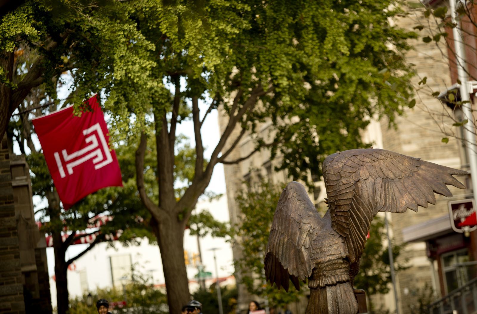 O'Connor Plaza with owl statue and trees on Temple University campus