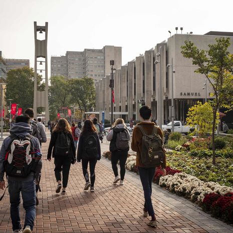 Students walking across Polett Walk on Main Campus