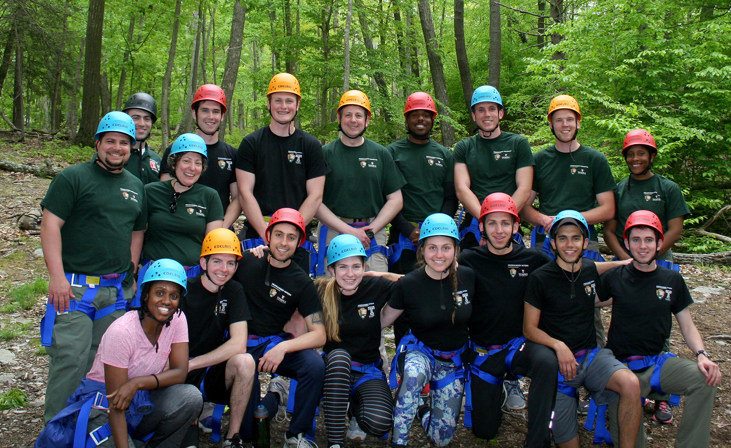 group photo of students participating in a ropes course. 