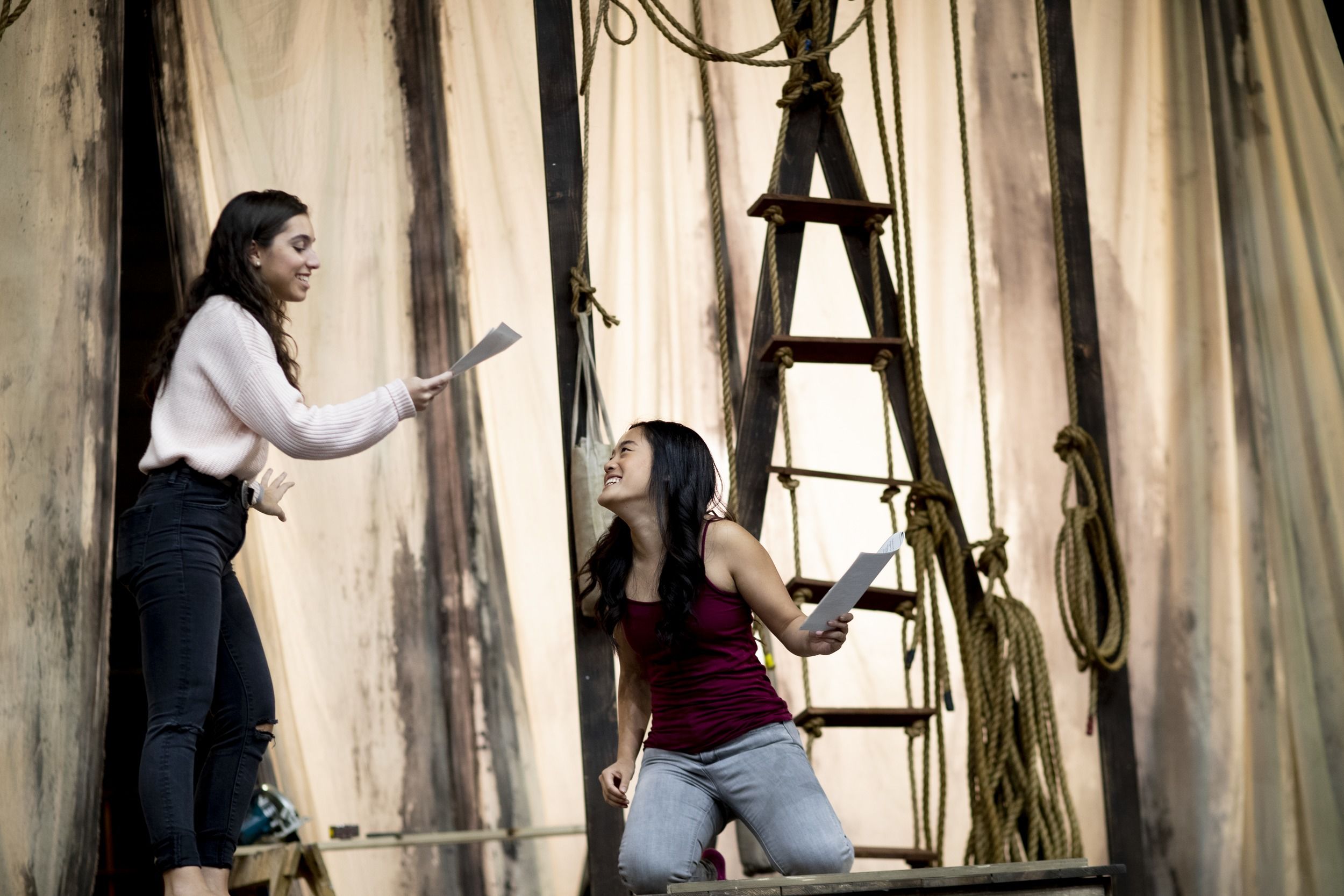 A pair of Temple students run through a scene together.