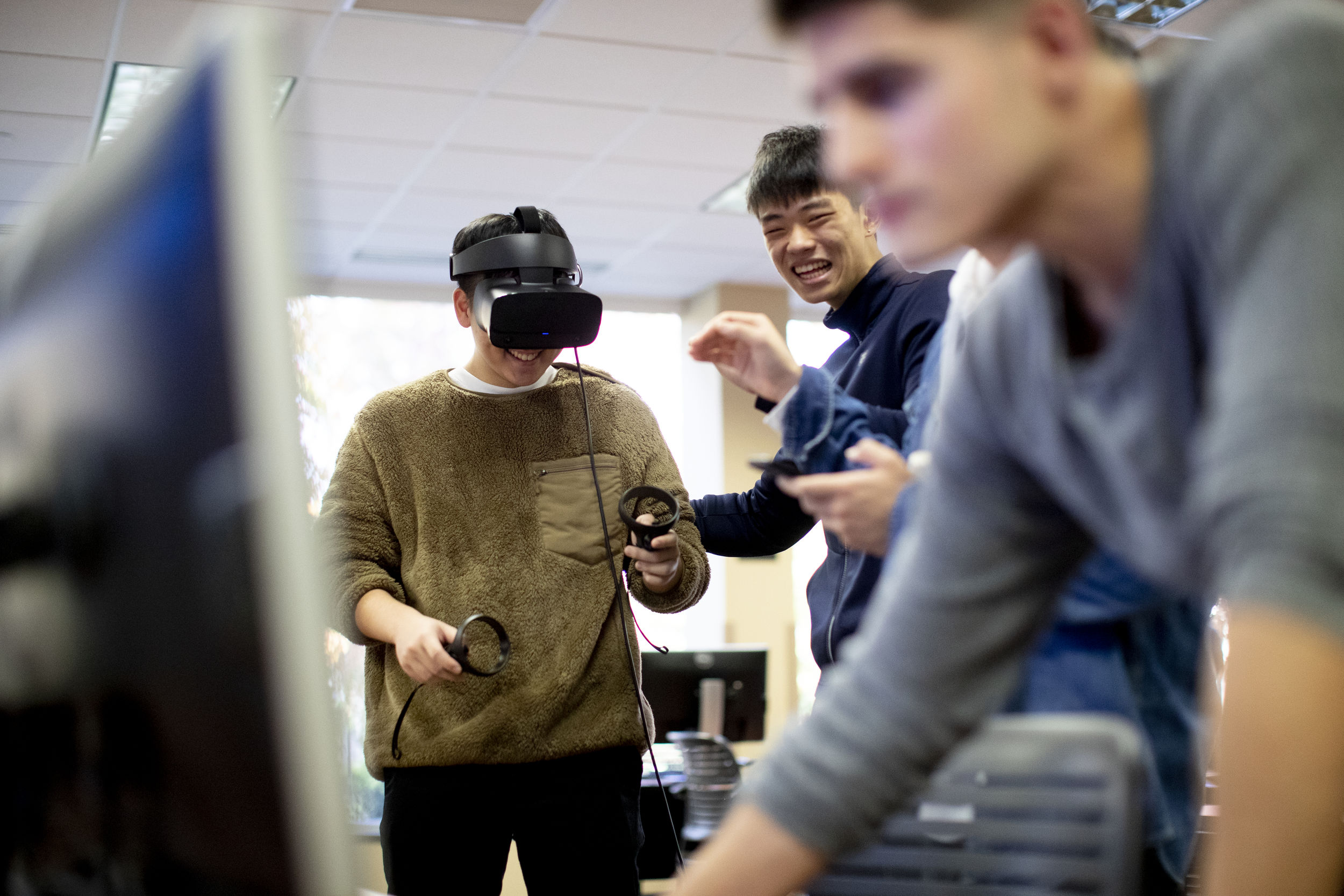 Students using virtual reality equipment.