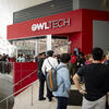 people gathering outside of OWLtech store.