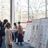 Families looking at diagrams of dorm room housing options